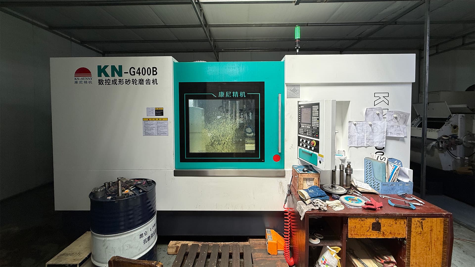 Workshop operation scene for gear manufacturing.